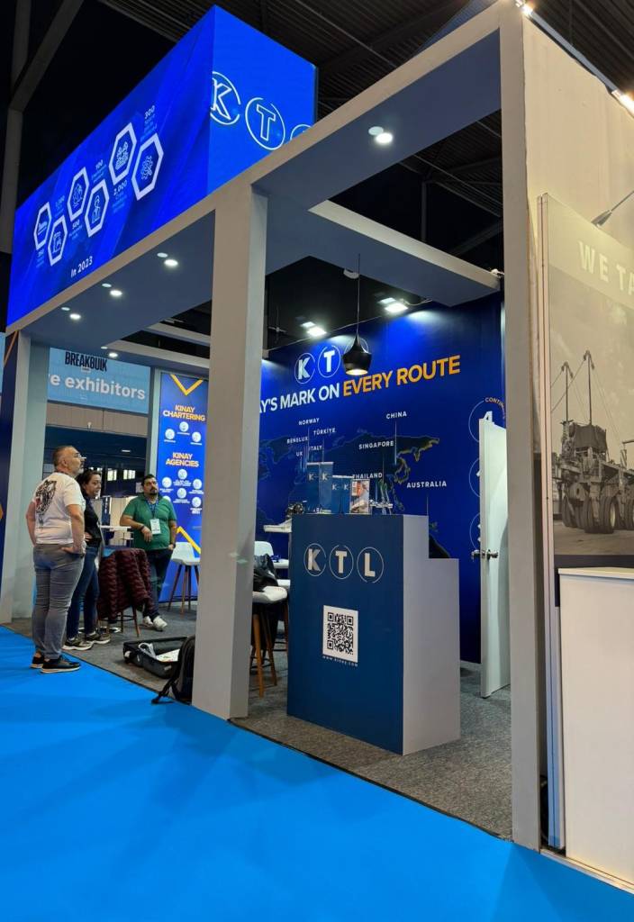 Cargo logistics breakbulk exhibition stand for KINAY with container mock-up elements, maritime visuals, route graphics and fully engineered turnkey build